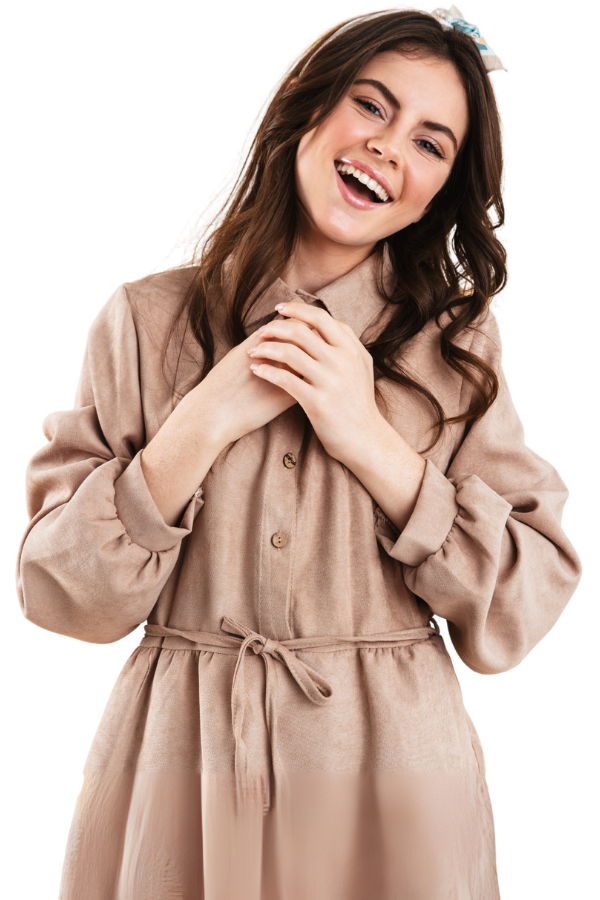 A smiling woman with his arms crossed.